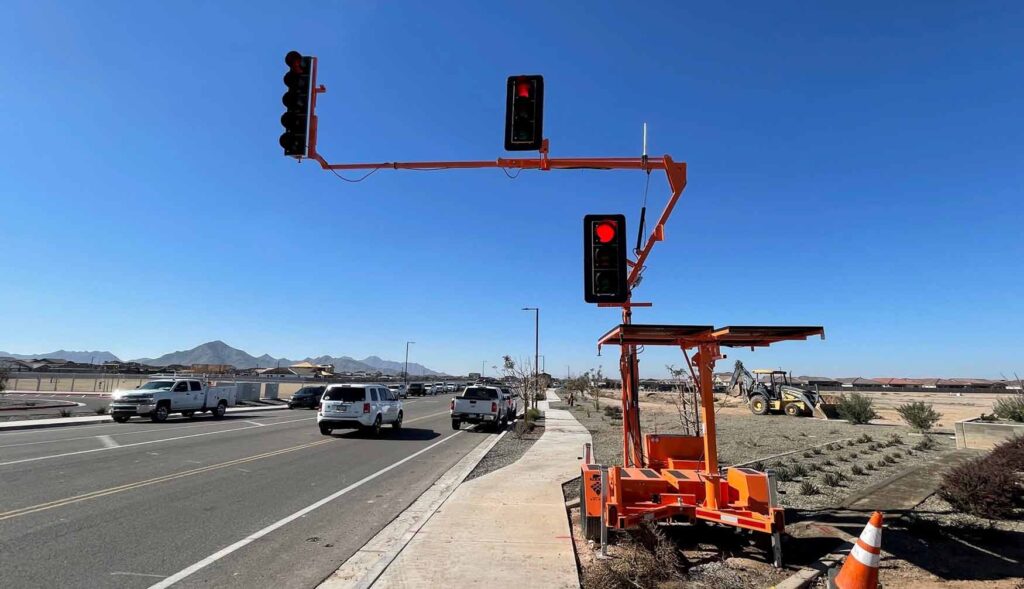 Extended portable traffic signal in pilot car operations work zone